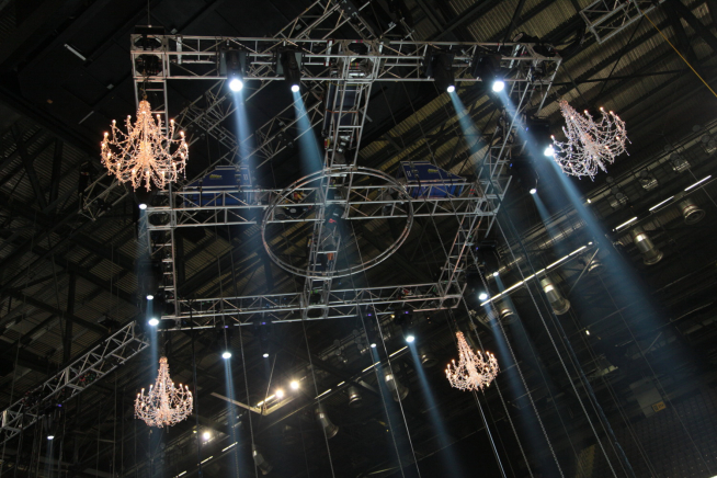 4 chandeliers suspended in huge venue